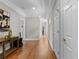 Wide hallway with hardwood floors and white trim at 3905 Merriweather Woods, Johns Creek, GA 30022