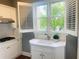 Bright kitchen featuring sink with marble countertop and garden window for natural light and a view at 3905 Merriweather Woods, Johns Creek, GA 30022