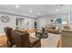 Cozy living room featuring hardwood floors, comfortable seating, and recessed lighting at 3905 Merriweather Woods, Johns Creek, GA 30022