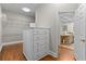 This walk-in closet boasts built-in storage shelves and hardwood floors at 3905 Merriweather Woods, Johns Creek, GA 30022