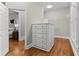The walk-in closet features built-in shelving, drawers, and hardwood floors at 3905 Merriweather Woods, Johns Creek, GA 30022