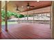 Large back porch with ceiling fans, white columns, and backyard views at 125 Sandridge Ct, Alpharetta, GA 30022