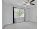 Bedroom featuring carpet, double windows with decorative drapes, and a ceiling fan at 125 Sandridge Ct, Alpharetta, GA 30022