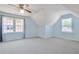 Spacious bedroom with carpeted floors, a ceiling fan, and two large windows at 125 Sandridge Ct, Alpharetta, GA 30022
