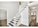 Bright foyer with a staircase and wooden floors at 125 Sandridge Ct, Alpharetta, GA 30022