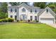 Charming two-story home with landscaped yard and a well manicured lawn at 125 Sandridge Ct, Alpharetta, GA 30022