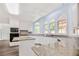 Modern kitchen with granite countertops, island and stainless appliances at 125 Sandridge Ct, Alpharetta, GA 30022