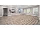 Large finished basement with stylish floors, white trim, and natural light at 150 Rose Creek Dr, Covington, GA 30014