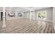 Finished basement with stylish floors, white trim, and walkout to the exterior at 150 Rose Creek Dr, Covington, GA 30014