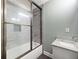Updated bathroom with tub, shower, glass door, granite vanity, and updated fixtures at 150 Rose Creek Dr, Covington, GA 30014