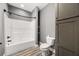 Bathroom featuring a shower-tub combo and modern fixtures at 150 Rose Creek Dr, Covington, GA 30014