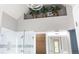Bathroom featuring a walk-in shower, vanity, and plant decor above at 150 Rose Creek Dr, Covington, GA 30014