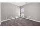 Neutral bedroom with gray carpet, window, and natural light at 150 Rose Creek Dr, Covington, GA 30014
