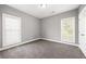Bedroom with gray carpet, light-colored walls, and windows at 150 Rose Creek Dr, Covington, GA 30014
