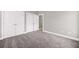 Bedroom with gray carpet and double doors at 150 Rose Creek Dr, Covington, GA 30014