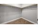 Walk-in closet with carpeted flooring and wood trim at 150 Rose Creek Dr, Covington, GA 30014