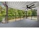 The expansive deck offers stunning views of the wooded backyard and is perfect for entertaining at 150 Rose Creek Dr, Covington, GA 30014