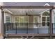 Covered deck with ceiling fan provides a relaxing outdoor living space with views of the backyard at 150 Rose Creek Dr, Covington, GA 30014