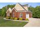Beautiful brick home with a well manicured lawn and landscaping at 150 Rose Creek Dr, Covington, GA 30014