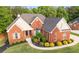 Beautiful two-story brick house with manicured landscaping and a welcoming front entrance at 150 Rose Creek Dr, Covington, GA 30014