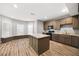 Spacious kitchen featuring an island, stainless steel appliances, ample cabinets, and light countertops at 150 Rose Creek Dr, Covington, GA 30014