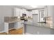Bright kitchen features white cabinets, granite countertops, stainless steel appliances, and a gray tile backsplash at 150 Rose Creek Dr, Covington, GA 30014
