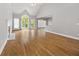 Bright living area featuring a fireplace, hardwood floors, vaulted ceilings, and access to a deck at 150 Rose Creek Dr, Covington, GA 30014