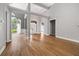 Bright living room featuring high ceilings with beams and hardwood floors at 150 Rose Creek Dr, Covington, GA 30014