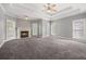 Spacious main bedroom featuring a trey ceiling, a fireplace and neutral colors at 150 Rose Creek Dr, Covington, GA 30014
