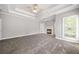 Spacious main bedroom featuring a trey ceiling, a fireplace and neutral colors at 150 Rose Creek Dr, Covington, GA 30014