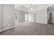 Spacious main bedroom featuring a trey ceiling, neutral colors and en suite bathroom at 150 Rose Creek Dr, Covington, GA 30014
