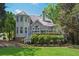 Spacious backyard with a deck and well-maintained landscaping, offering an ideal space for relaxation and entertaining at 320 Ironhill Trce, Woodstock, GA 30189