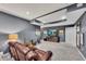 Finished basement with entertainment setup including a television and instruments at 320 Ironhill Trce, Woodstock, GA 30189