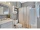 Bathroom featuring a vanity and tub with shower at 320 Ironhill Trce, Woodstock, GA 30189