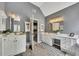 Bathroom featuring double sinks, vanity, cabinets, and wood-look flooring at 320 Ironhill Trce, Woodstock, GA 30189