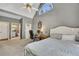 Bedroom featuring a vaulted ceiling, desk, and an ensuite bathroom at 320 Ironhill Trce, Woodstock, GA 30189