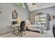 Bedroom with vaulted ceiling, large window, desk, bed, and ceiling fan at 320 Ironhill Trce, Woodstock, GA 30189