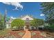 Exterior shot of the clubhouse with a beautifully landscaped entrance and classic architectural details at 320 Ironhill Trce, Woodstock, GA 30189