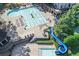 Aerial view of community pool area with slide, lap pool and ample deck space for lounging at 320 Ironhill Trce, Woodstock, GA 30189