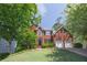 Inviting two-story brick home with a well-kept front yard, featuring a two-car garage and classic American design at 320 Ironhill Trce, Woodstock, GA 30189