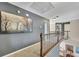 Open hallway with picture frame molding, carpet floors, and decorative lighting at 320 Ironhill Trce, Woodstock, GA 30189