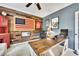 Well-appointed home office with custom wooden desk, decor, and ample natural light for a comfortable workspace at 320 Ironhill Trce, Woodstock, GA 30189