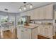 Stylish kitchen with stainless appliances, painted cabinets, large island, and an eat-in dining area at 320 Ironhill Trce, Woodstock, GA 30189