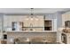 Kitchen with island and bar seating, and modern stainless steel appliances at 320 Ironhill Trce, Woodstock, GA 30189