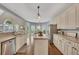Kitchen with a view to the breakfast nook, stainless steel appliances, and island at 320 Ironhill Trce, Woodstock, GA 30189