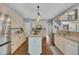 Kitchen featuring stainless steel appliances, an island, and view to the upstairs at 320 Ironhill Trce, Woodstock, GA 30189