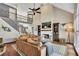 Open living room with a fireplace, vaulted ceiling, and view to the upstairs balcony at 320 Ironhill Trce, Woodstock, GA 30189