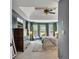 Spacious main bedroom suite with tray ceilings, bay windows, and neutral decor at 320 Ironhill Trce, Woodstock, GA 30189