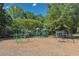 Community playground with colorful play structures, swings, and a shaded gazebo at 320 Ironhill Trce, Woodstock, GA 30189