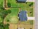 An aerial shot shows a home's spacious backyard, mature trees, and well-kept lawn at 321 Shannon Ct, Mcdonough, GA 30252